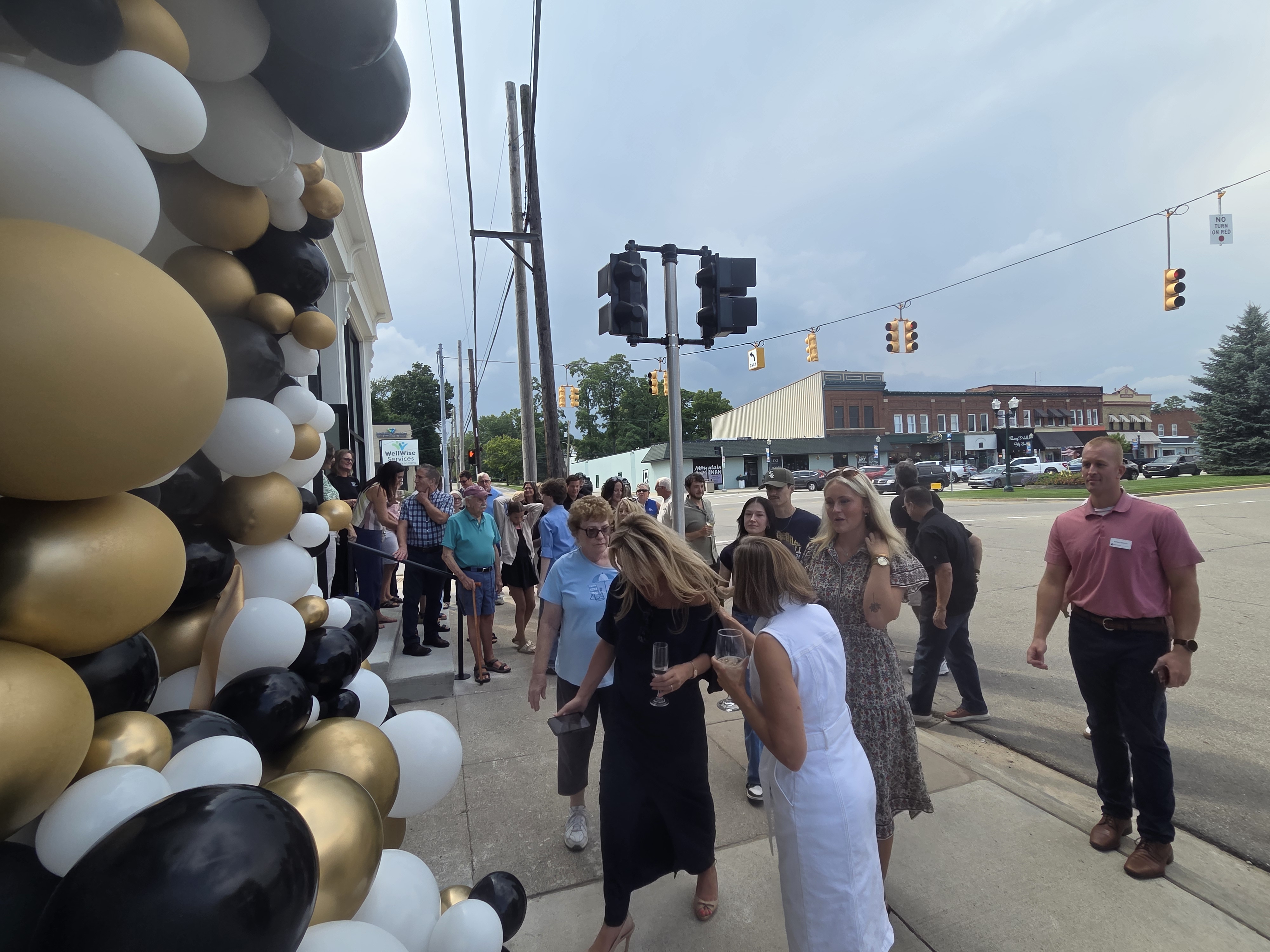 Guests gathering outside Fetch’s balloon-framed entrance.