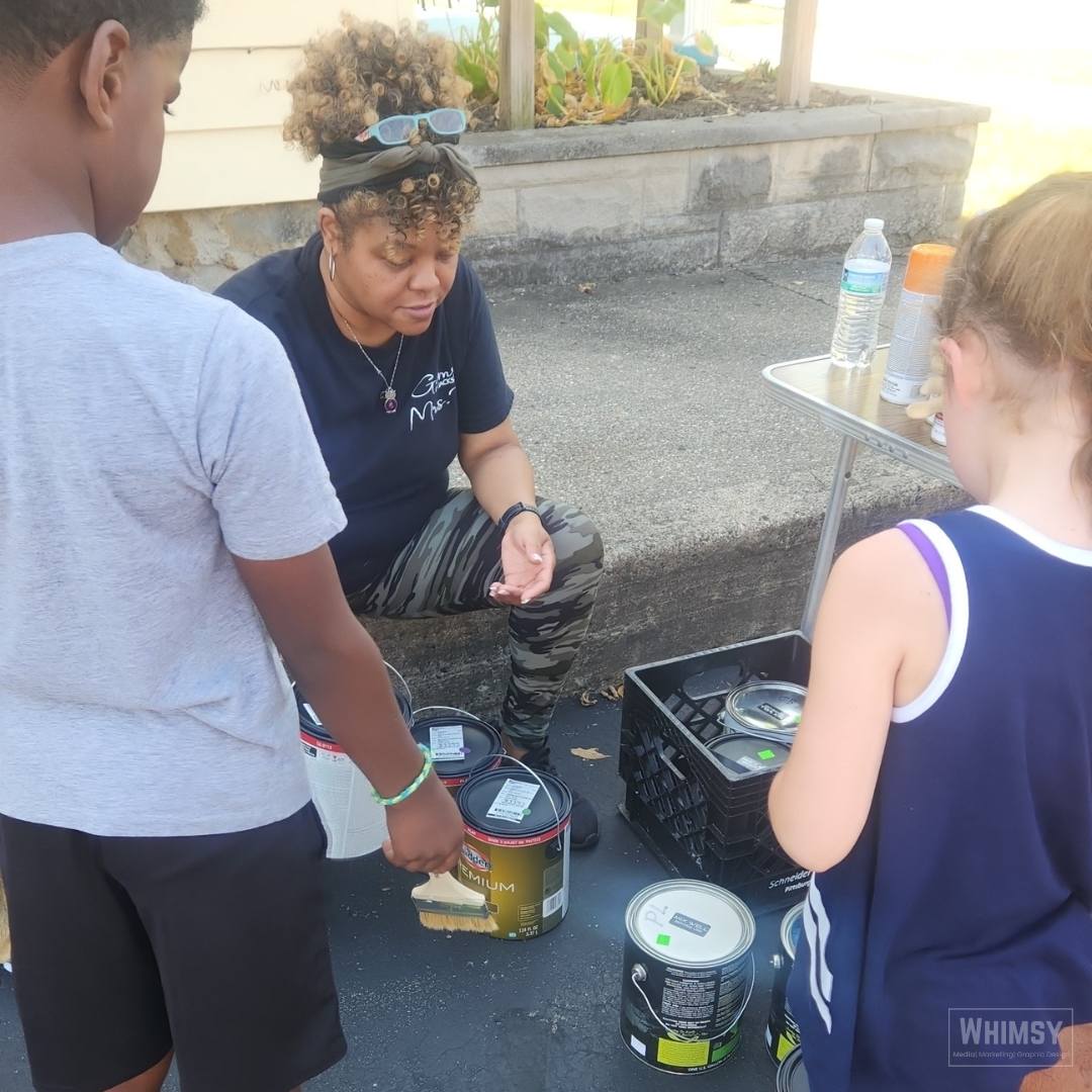 Paint supplies being organized during WHO's sensory playground workday