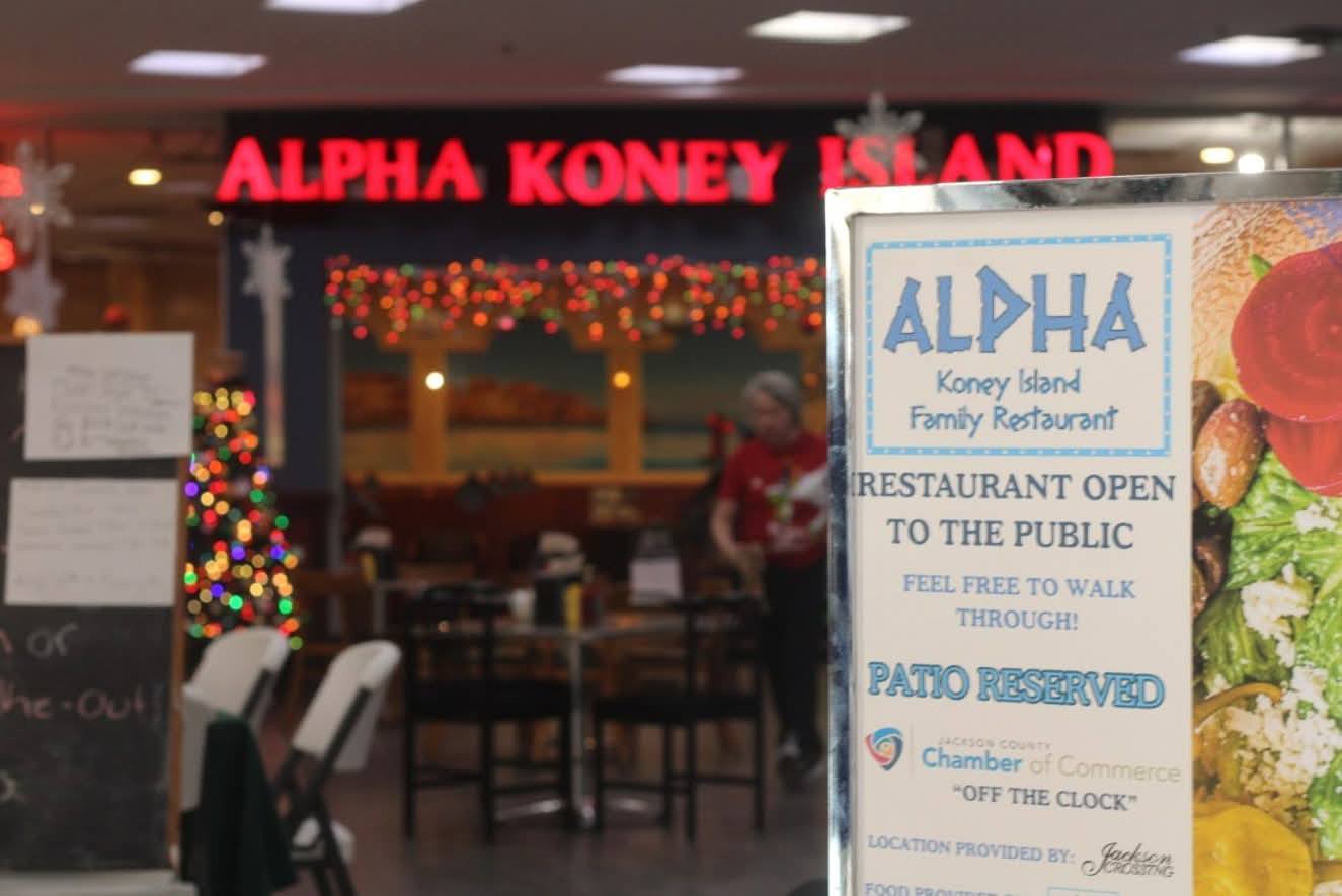 Alpha Koney Island's entrance and Chamber networking event sign at Jackson Crossing