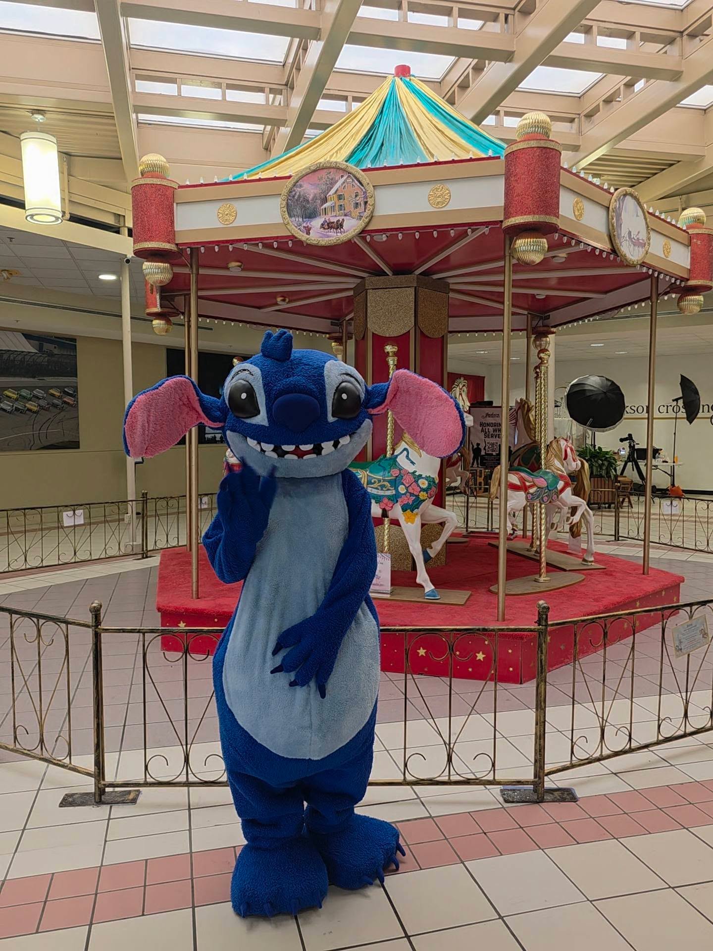 Kids meeting Stitch beside the carousel